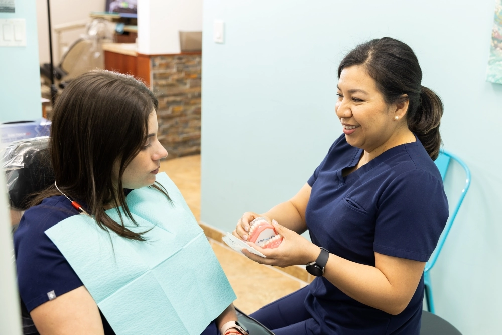 Dental professional talking with the patient
